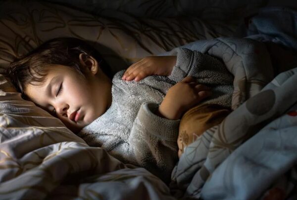 a serene nighttime bedroom scene illuminated by soft moonlight, featuring a peacefully sleeping child nestled under cozy blankets, with gentle shadows highlighting their relaxed expression amidst an atmosphere of tranquility.